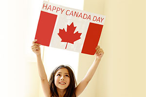 A Little Girl Holding Happy Canada Day Flag!